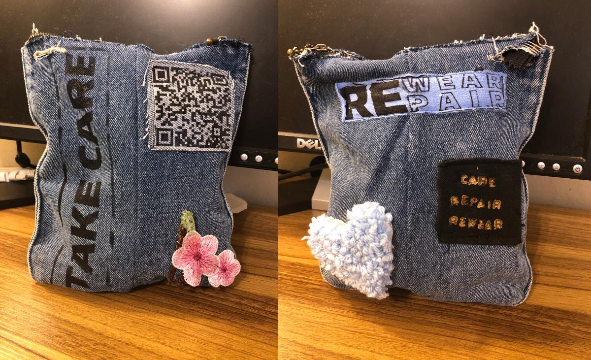 a denim pouch with printed and sewn objects on it
