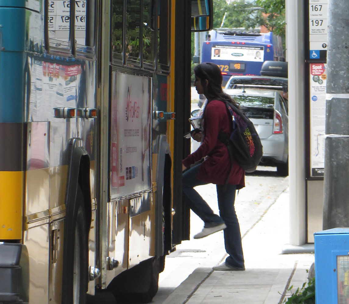 woman boarding a bus